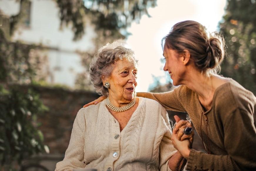 Happy Lady being looked after by a carer